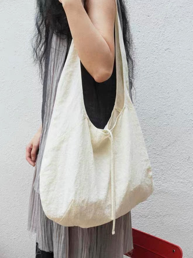 <Another i.> Adjustable Egg-Shaped Crossbody Bag