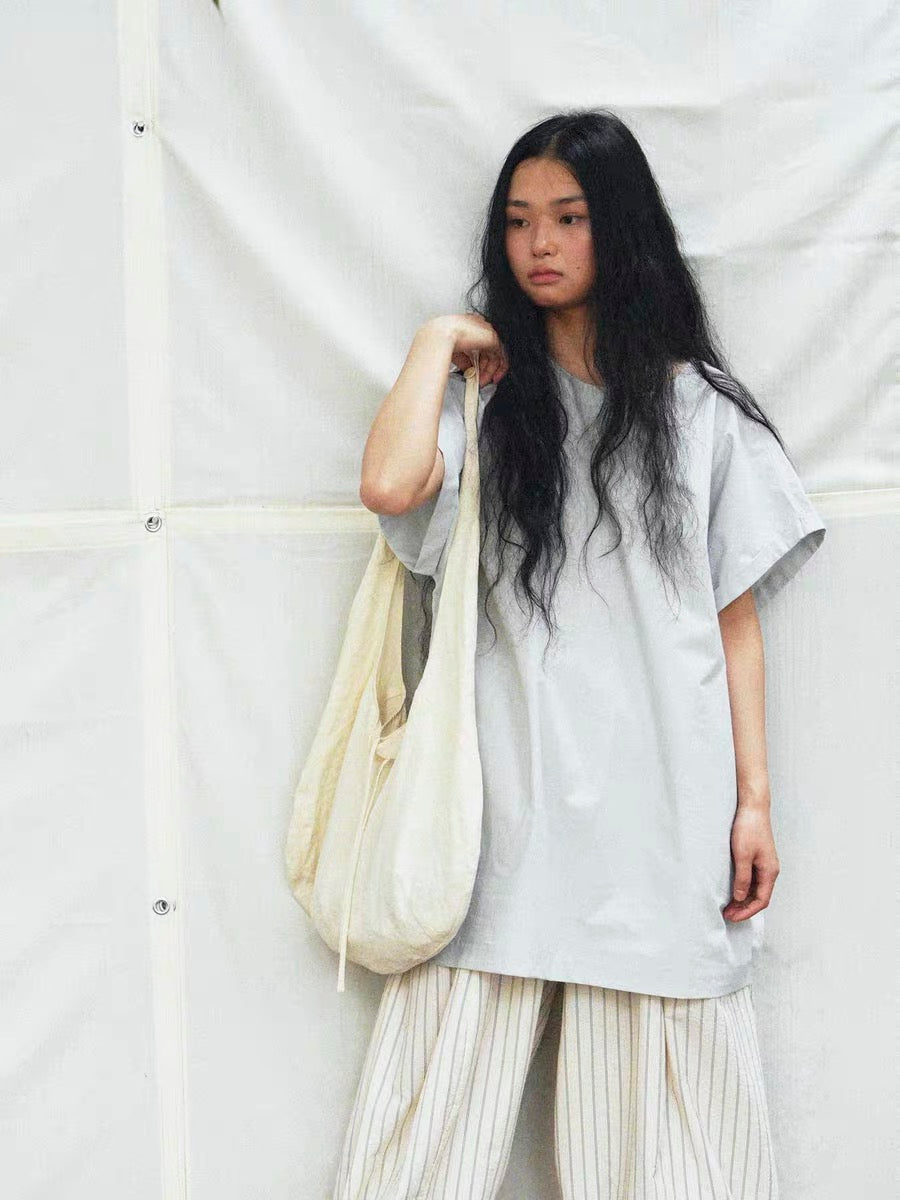 <Another i.> Adjustable Egg-Shaped Crossbody Bag