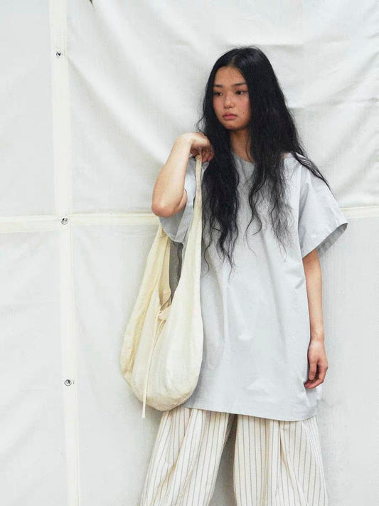 <Another i.> Adjustable Egg-Shaped Crossbody Bag