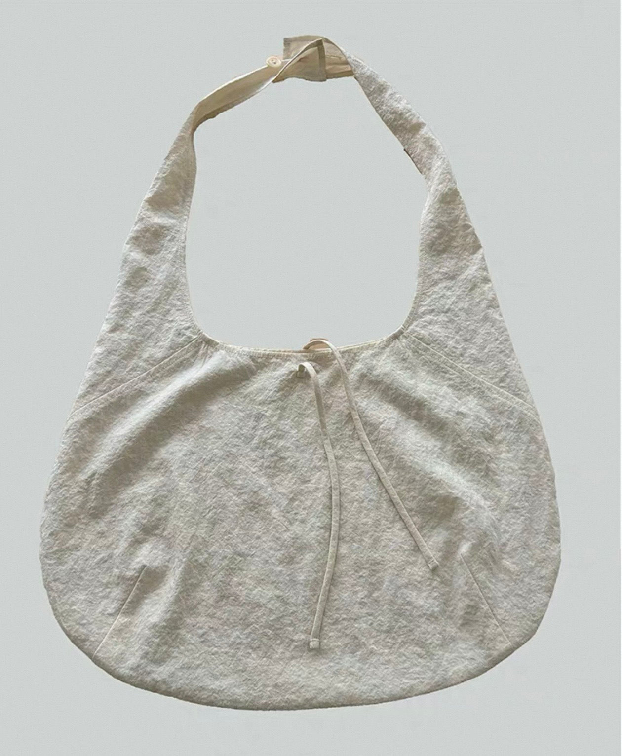 <Another i.> Adjustable Egg-Shaped Crossbody Bag