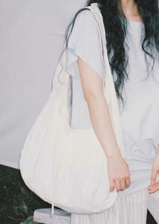 <Another i.> Adjustable Egg-Shaped Crossbody Bag