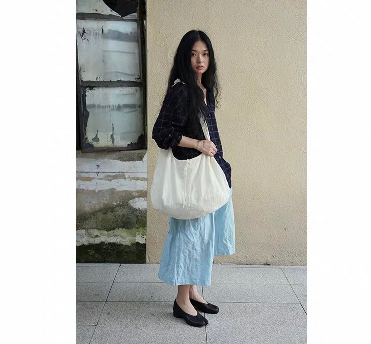 <Another i.> Adjustable Egg-Shaped Crossbody Bag