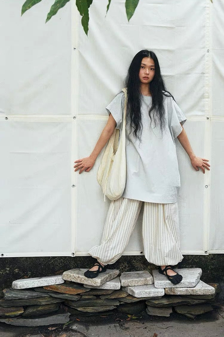 <Another i.> Adjustable Egg-Shaped Crossbody Bag