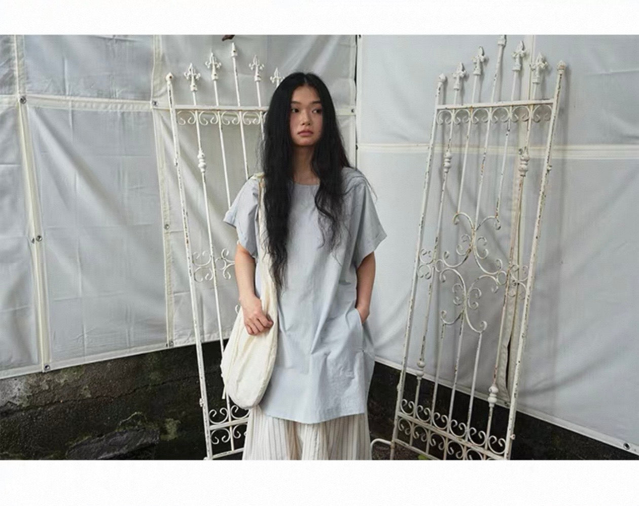<Another i.> Adjustable Egg-Shaped Crossbody Bag