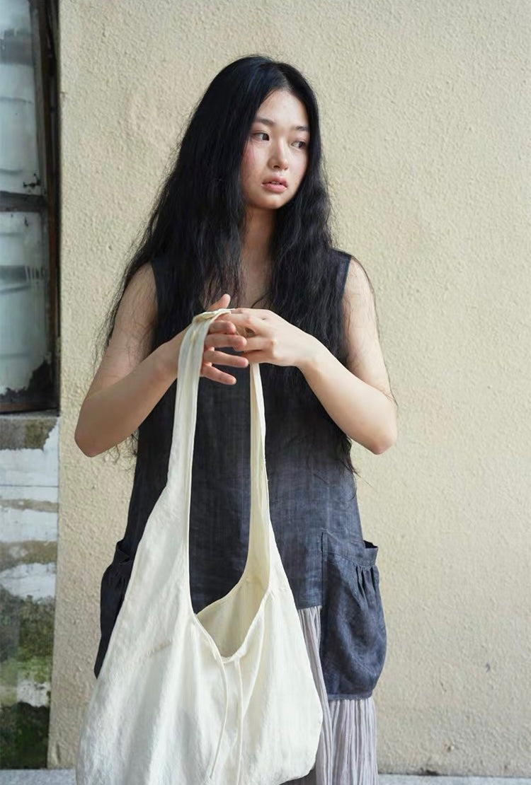 <Another i.> Adjustable Egg-Shaped Crossbody Bag