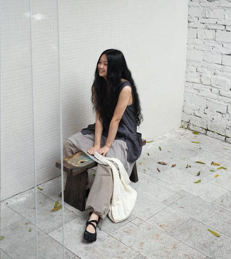 <Another i.> Adjustable Egg-Shaped Crossbody Bag